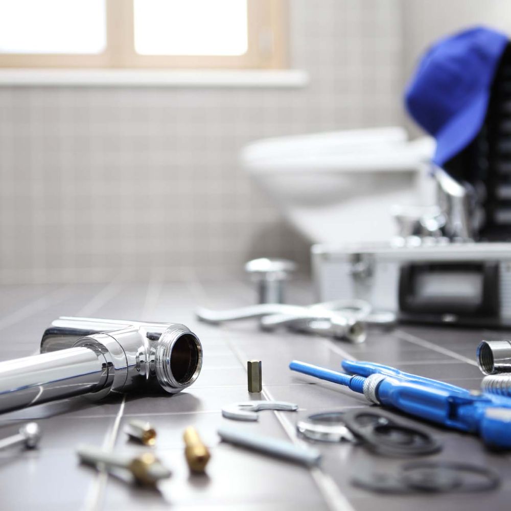 plumber tools and equipment in a bathroom, plumbing repair service, assemble and install concept
