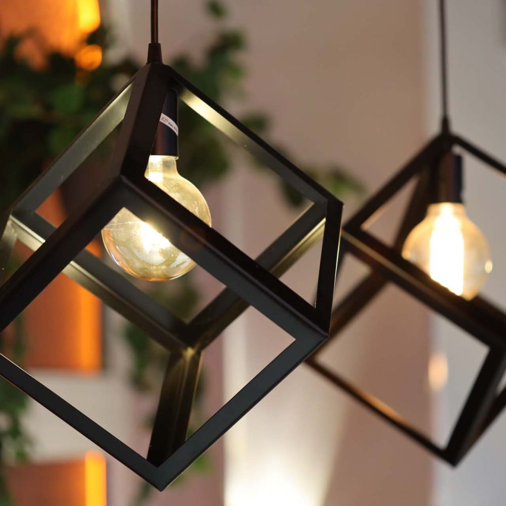 Two light fixtures suspended from the ceiling, providing soft lighting.